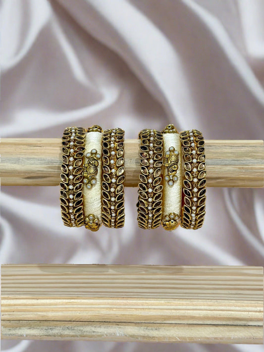 Gold and Cream(off-white) Colour Silk Thread Kundan Bangle Set With Elephant Charms and Gold Kundans, Pearls and Stonea